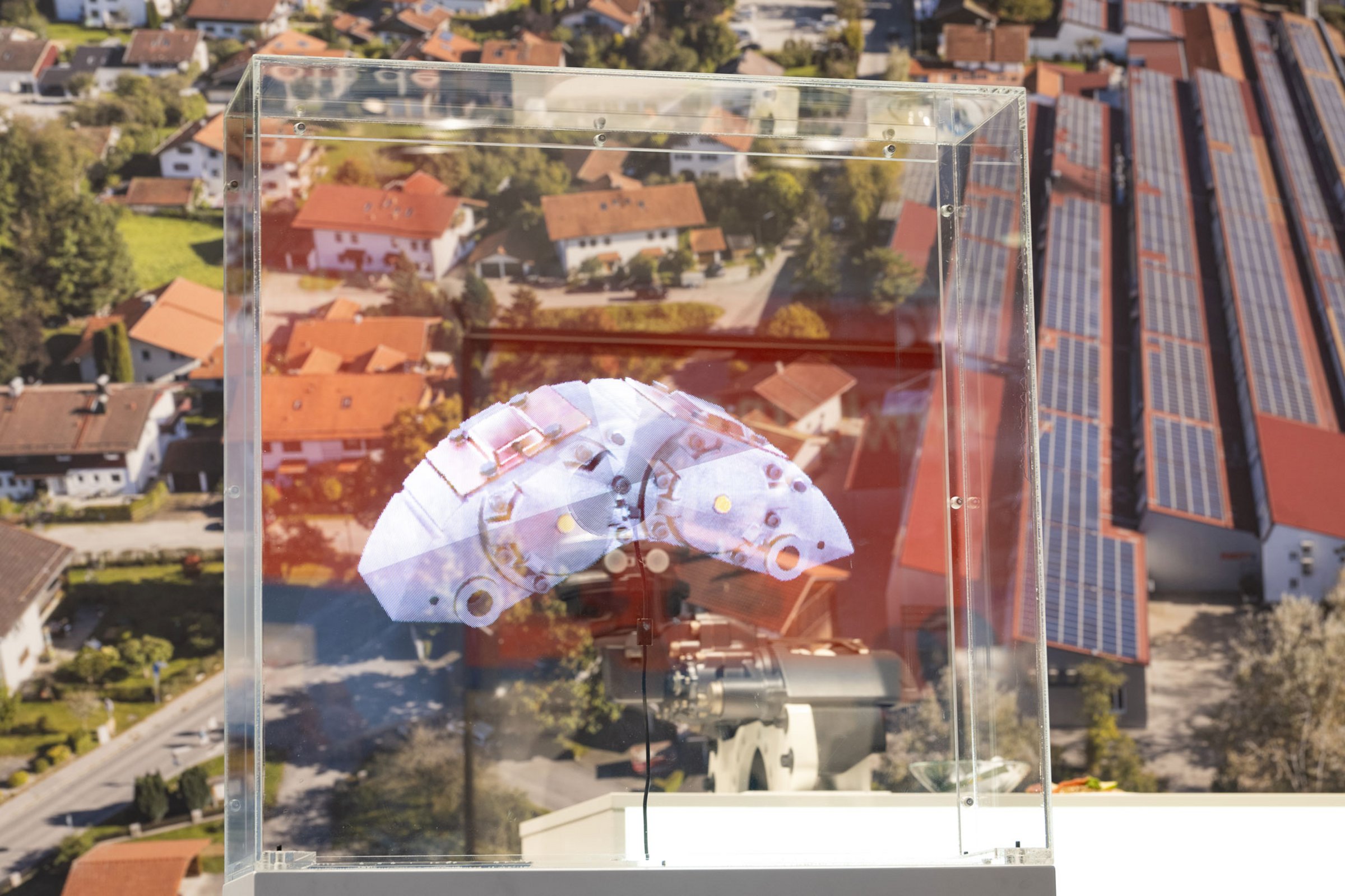 Technical exhibit in display case in front of housing estate